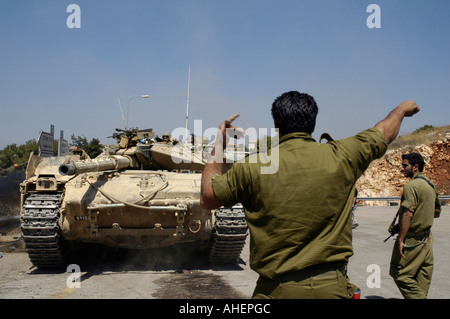 An Israeli Merkava tank maneuvers near the Israel-Lebanon border in Avivim during Israel - Hezbullah war Stock Photo