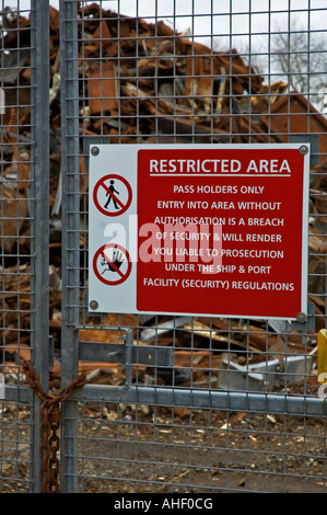 a no entry sign on the gates of a scrap yard in cornwall,england Stock Photo