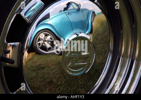 reflection of VW Beetle in wheel hub of the same Stock Photo