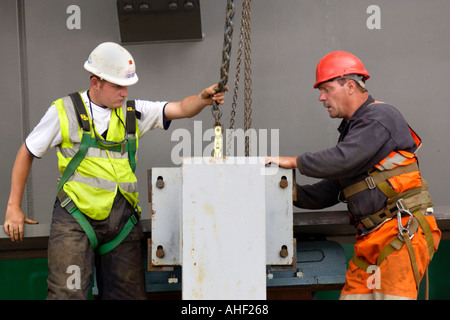 Working on the directional guides and jacking points of a road bridge being winched over the River Usk at Newport South Wales UK Stock Photo