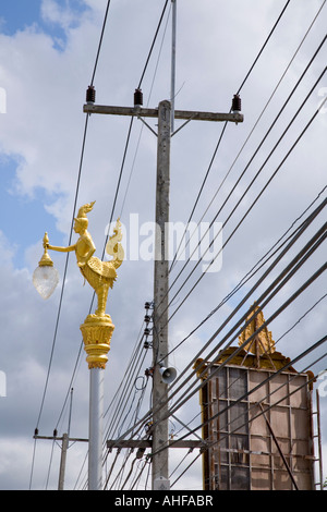 Street lighting and electricity cables and telephone wires in Thailand Stock Photo