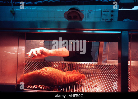 Cooked battered fish at the original Harry Ramsdens fish and chip shop Guiesley Yorkshire. Stock Photo