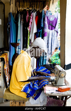 Tailor at work on his stall in the Senegambia Craft Market, Kololi, The Gambia, Africa Stock Photo