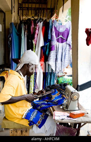 Tailor at work on his stall in the Senegambia Craft Market, Kololi, The Gambia, Africa Stock Photo