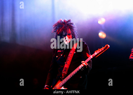 Nikki Sox, bassist, Motley Crue, Heavy Metal band, from Los Angeles, California, bass, guitar, performer, music, musician, stageVince Neil, vocals, Nikki Sox, bass, Mick Mars, guitar, Tommy Lee, Drums, Download Rock Festival, Donnington Park, Leicestershire, UK Stock Photo