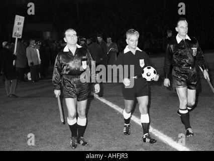 football, European Cup Winners Cup, 1966/1967, eighth final, return leg, Borussia Dortmund versus Glasgow Rangers 0:0, Stadium Rote Erde in Dortmund, match officials come in the stadium, referee Romantschev from Bulgaria (with ball), left and right the re Stock Photo