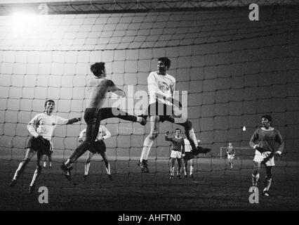 football, Bundesliga, 1968/1969, FC Schalke 04 versus Eintracht Frankfurt 2:0, Glueckaufkampfbahn Stadium in Gelsenkirchen, scene of the match, f.l.t.r. Bernd Hoelzenbein (Frankfurt), keeper Norbert Nigbur (Schalke), Ernst Abbe (Frankfurt), Herbert Hoebus Stock Photo