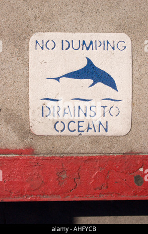'No Dumping Drains to Ocean' notice on Rodeo Drive, Beverly Hills, Los Angeles, California Stock Photo