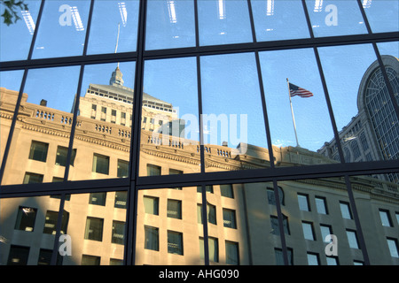 Boston buildings and flag reflected in windows Stock Photo