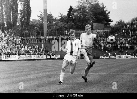 football, Bundesliga, 1968/1969, Boekelberg Stadium, Borussia Moenchengladbach versus Eintracht Brunswick 1:1, scene of the match, duel between Klaus Ackermann (Gladbach) left and Peter Kaack (Braunschweig) Stock Photo