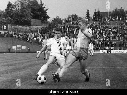 football, Bundesliga, 1968/1969, Boekelberg Stadium, Borussia Moenchengladbach versus Eintracht Brunswick 1:1, scene of the match, duel between Herbert Laumen (Gladbach) left and Peter Kaack (Braunschweig) Stock Photo