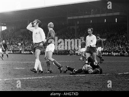 football, Bundesliga, 1969/1970, FC Schalke 04 versus Rot-Weiss Oberhausen 2:2, Glueckaufkampfbahn Stadium in Gelsenkirchen, scene of the match, scoring chance missed, f.l.t.r. Hans Fritsche (Oberhausen), Rolf Ruessmann, Klaus Fichtel (both Schalke), Hugo Stock Photo