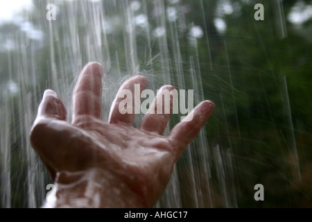 hand in rain storm Stock Photo