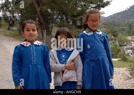 Turkish school girls of primary age going home for lunch midday in rural village of Islamla in Southern Turkey. Stock Photo