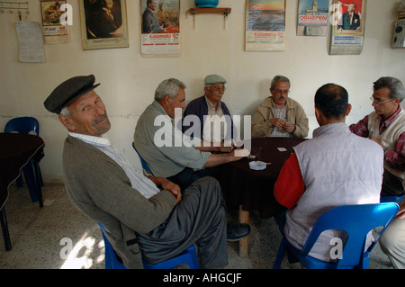 Turkish men in village cafe playing games and sitting about socialising Stock Photo