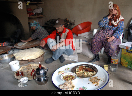 Family of different generations having meal in small rural village of Eymir in Anatolia Southern Turkey. Stock Photo