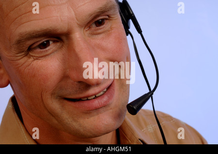 Man wearing a telephone headset Stock Photo