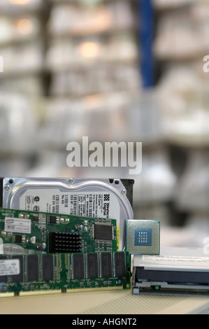 computer components hard drive memory processor video card floppy drive arranged in warehouse Stock Photo