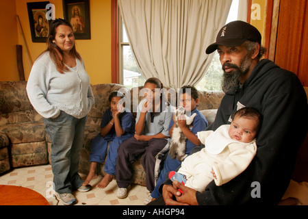 A modern aboriginal family group in their home at La Perouse Sydney Australia Stock Photo