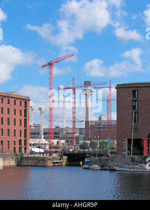 Cranes on skyline viewed from King Albert Dock. Liverpool building for European City of Culture 2008 Stock Photo