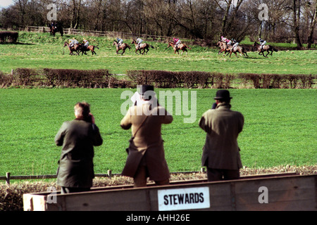 Horse racing stewards stand in a farm trailer to watch the racing at point to point meeting in Herefordshire England UK Stock Photo