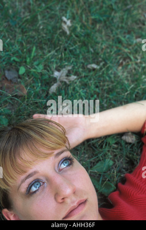 Girl Resting on Grass Stock Photo