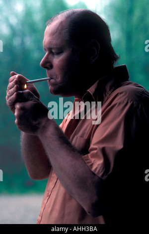 Lighting Cigarette Stock Photo