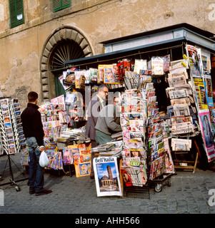 Customers outside kiosk and newsagent selling newspapers, magazines postcards at Campo dei Fiori market in Rome Italy Europe EU  KATHY DEWITT Stock Photo