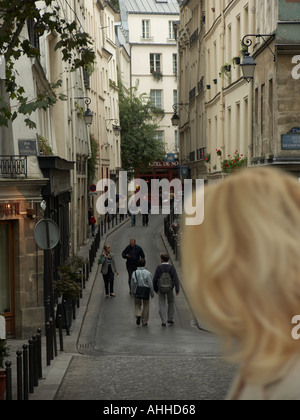 Woman looking down street in the Latin Quarter on the Left Bank of the Seine River in Paris France Stock Photo