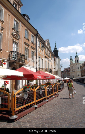 Restaurant at Freta Street, New Town in Poland, Saint Jacek's church (left) and Holy Spirit churches towers and in the back Stock Photo
