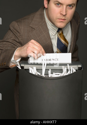 Man shredding the evidence Stock Photo