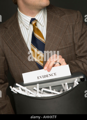 Man shredding evidence Stock Photo