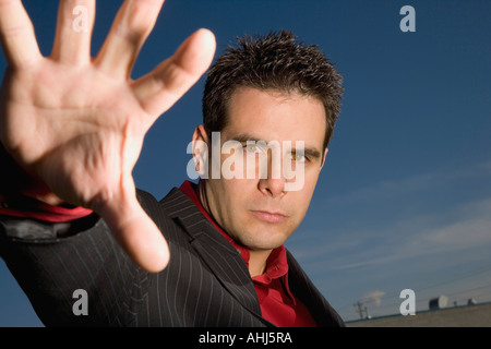 Man with outstretched arm Stock Photo