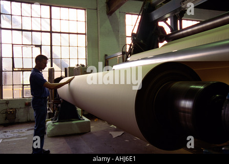 Rolls of paper passing through machines Smurfit paper factory, Snodland, UK Stock Photo