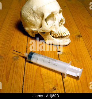 skull and injection for drugs. Photo by Willy Matheisl Stock Photo