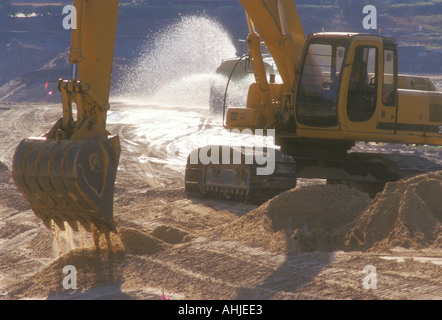 large digger machine on road construction Stock Photo