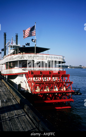 Paddle steamer Natchez moored on Mississippi River in New Orleans with US flag flying at stern. New Orleans, Louisiana, USA. Stock Photo
