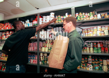 Volunteers from St John s Bread and Life Food Pantry prepare bags of groceries for clients on June 10 1998 The Food Pantry and it s Soup Kitchen feed neighborhood residents in the Brooklyn community of Bedford Stuyvesant The facility is located in the original building occupied by St John s University Richard B Levine Stock Photo