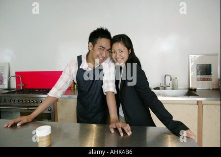 couple kitchen portrait Asian happy people Asian couple flowers romantic romance indoors head Asian couple in kitchen Stock Photo