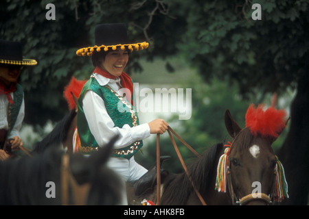 Young Girl Hispanic Dress Riding Horse Stock Photo