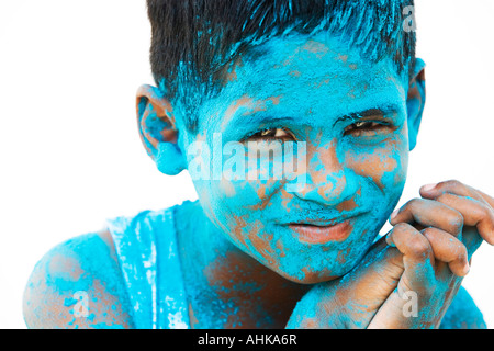 Indian boy covered in blue powder. India Stock Photo