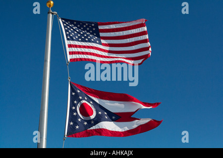 A United States flag flying over an Ohio state flag Stock Photo