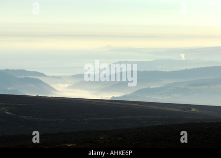 Dawn over Exmoor valleys as seen from the moors highest point Dunkery Hill Stock Photo