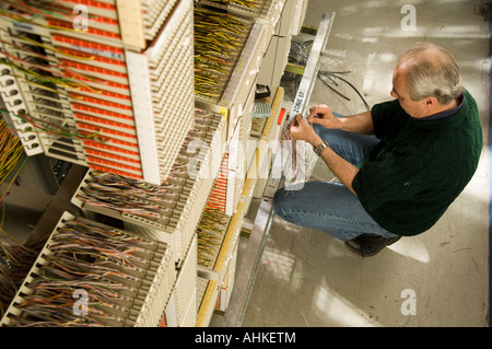 Man at work in Telecommunications Control Room Stock Photo