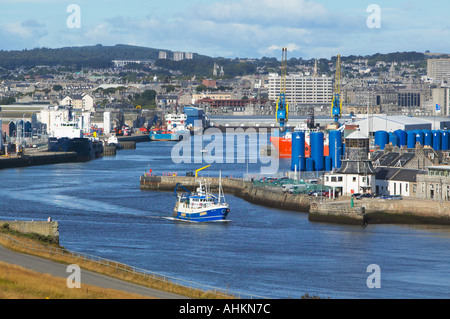 Aberdeen Harbour, Aberdeen, Scotland.  Small sishing boat leaving the harbour. Stock Photo