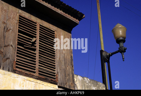 closed window and old street lamp Madeira Island Portugal Stock Photo