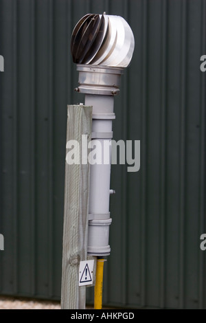 Wind powered electric water pump part of a garden centre s irrigation system Stock Photo