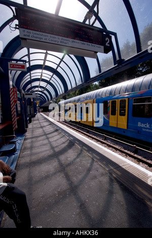 View of DLR Docklands light railway station with train Bow Church station Stock Photo