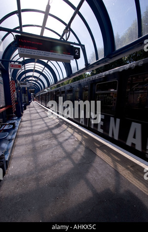 View of DLR Docklands light railway station with train Bow Church station Stock Photo