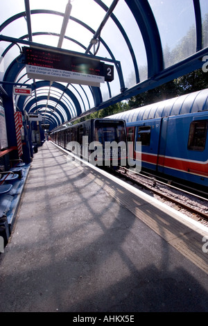 View of DLR Docklands light railway station with train Bow Church station Stock Photo